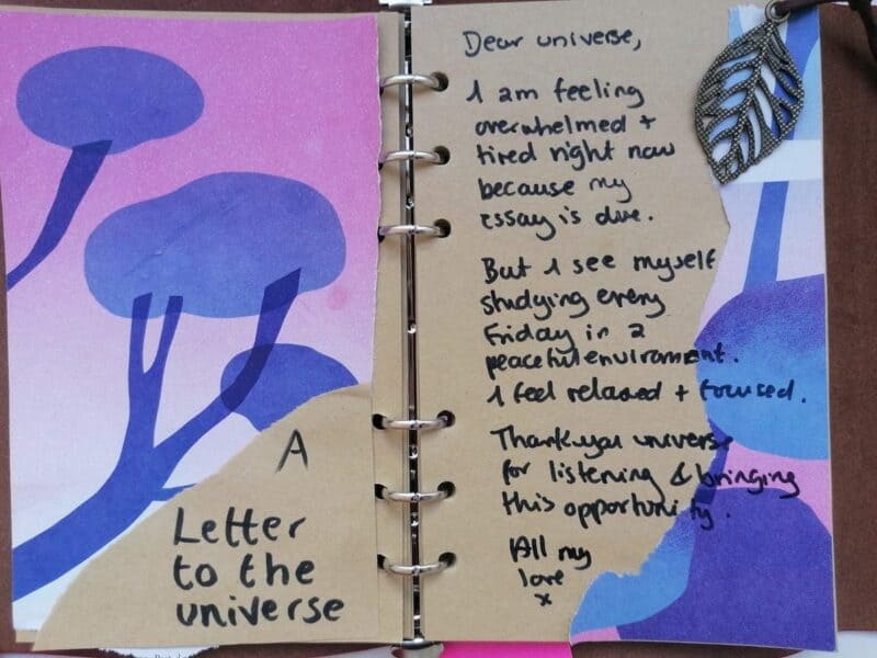 A journal spread showing a letter to the universe written asking for support and manifestations